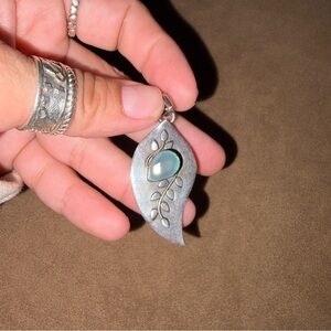 Elegant Silver Leaf Pendant with Blue Accent